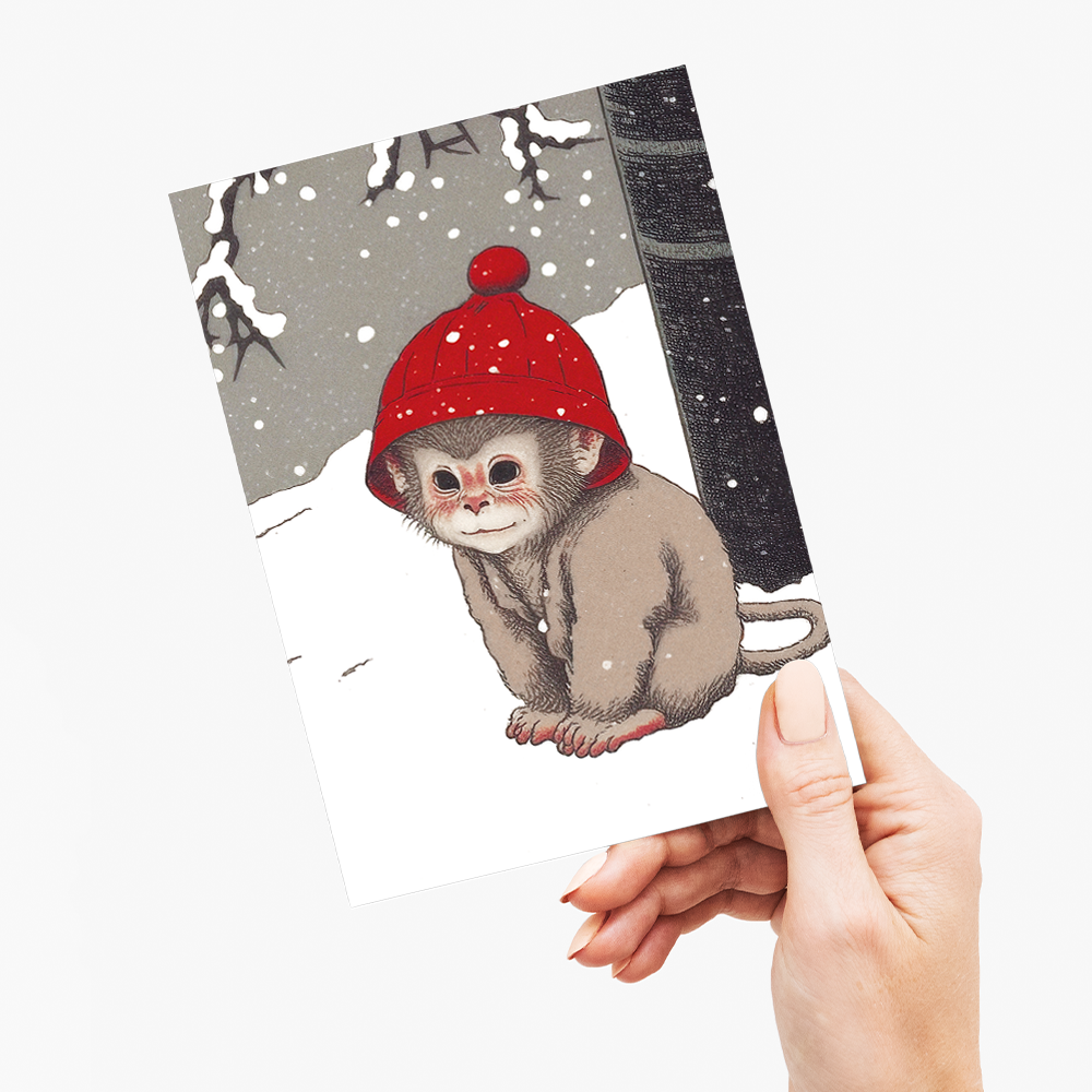 Baby monkey in the snow - Greeting Card