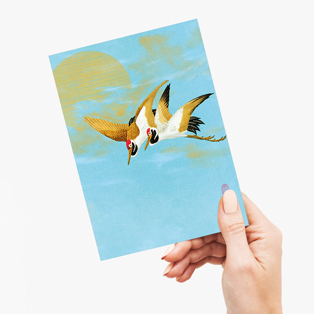 Two sarus crane flying in front of the moon - Greeting Card