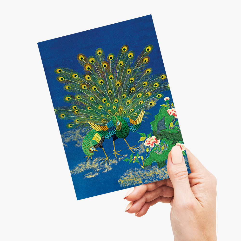 Peacock showing off to peahen - Greeting Card