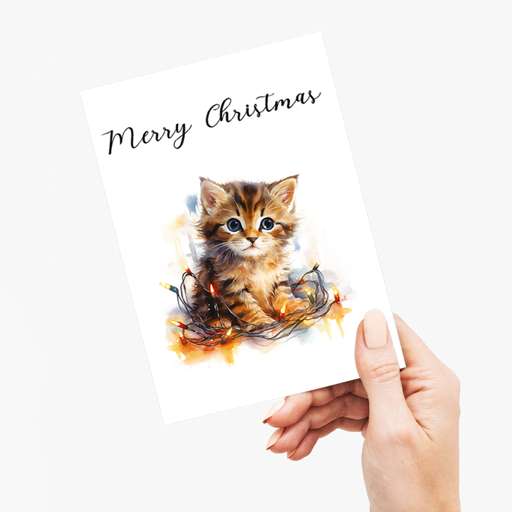 Kitten tangled in Christmas light - Greeting Card