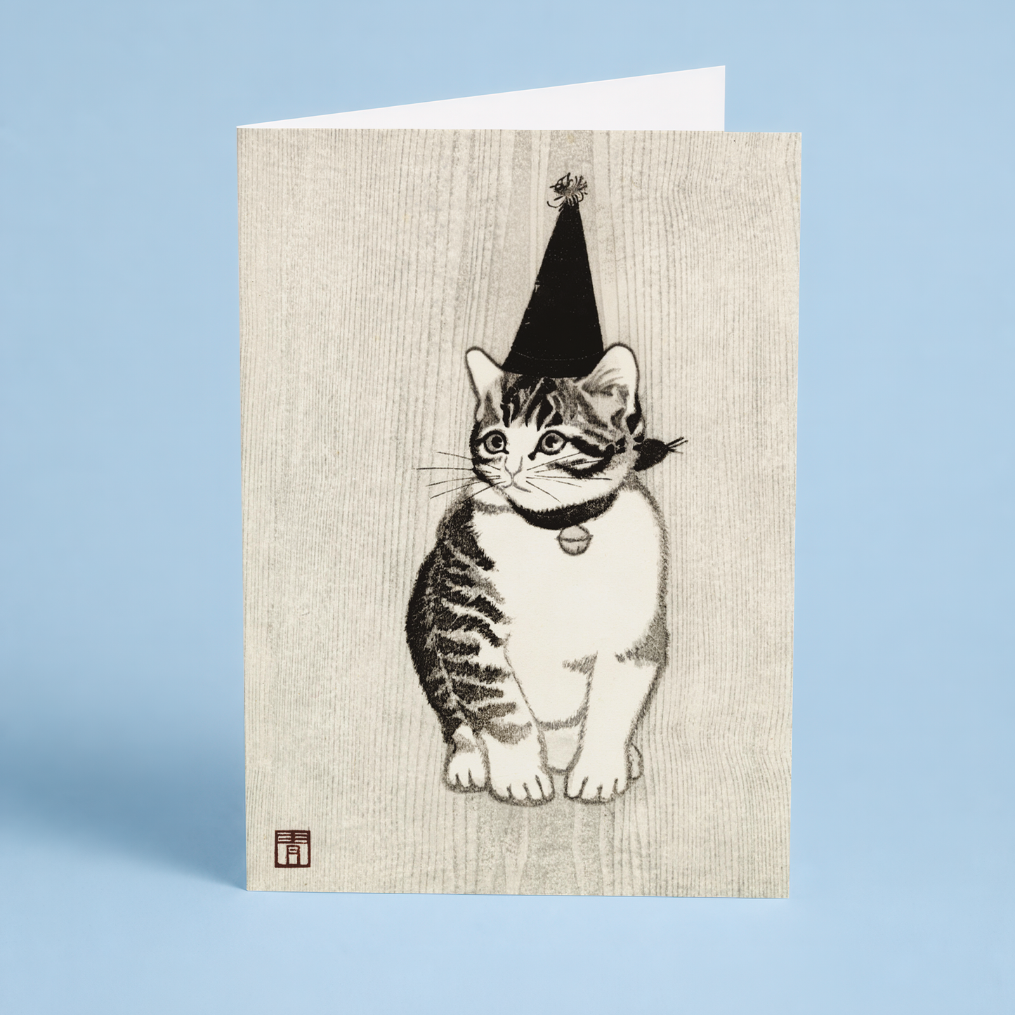 Kitten with Bell and party hat by Masaharu Aoyama - Greeting Card