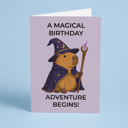A magical birthday adventure begins! (Capybara wizard) - Greeting Card