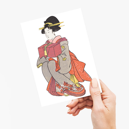 Japanese woman holding box By Kitagawa - Greeting Card